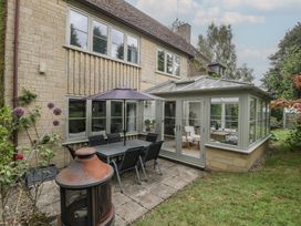 A garden with a patio table and chairs at St. Marys House Church Westcote near Bledington