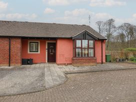 A bungalow entrance with a front door and windows at Bungalow 19 Eamont Park in Penrith