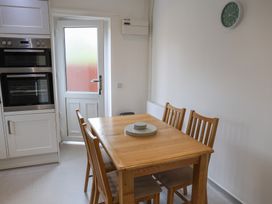 A kitchen with a dining table and chairs at Bungalow 19 Eamont Park in Penrith