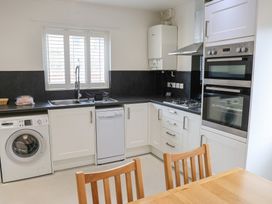 A kitchen with appliances and countertop at Bungalow 19 Eamont Park Penrith