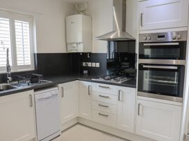 A kitchen with appliances and fixtures at Bungalow 19 Eamont Park in Penrith