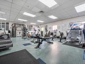 A gym with various fitness equipment at Jubilee Two Bedroom Bungalow Pet Free in Penrith