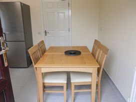 A dining room with table and chairs at Bungalow 14 Eamont Park Penrith