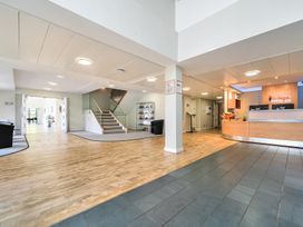 A lobby with a reception desk and seating area at Jubilee Two Bedroom Accessible Bungalow Pet Friendly in Penrith
