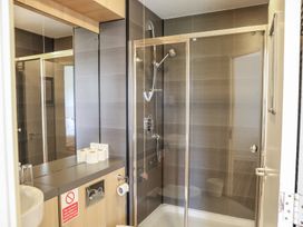A bathroom with a shower and sink at Bedroom 7 in Penrith