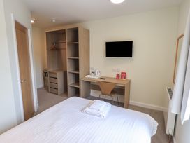 A bedroom with a bed and desk at Bedroom 2 in Penrith
