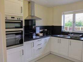 A kitchen with oven and kettle at House 8 Eamont Park Penrith