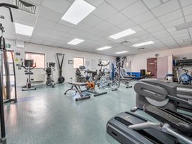 A gym with various exercise equipment at Jubilee Two Bedroom House Pet Free in Penrith