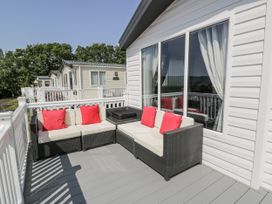 An outdoor seating area with a sofa and table at Number 42 Wemyss Bay