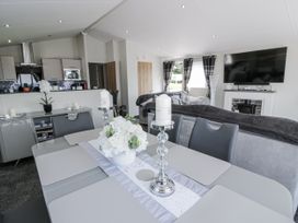 A dining room with a table and chairs at Number 42 Wemyss Bay