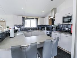 A kitchen with appliances and countertop at Number 42 Wemyss Bay
