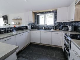 A kitchen with a sink and cabinets at Number 42 Wemyss Bay