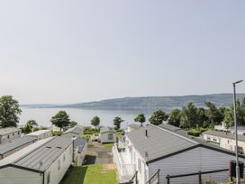 An outdoor area with caravans and water view at Number 42 Wemyss Bay