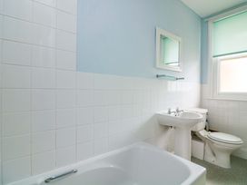 A bathroom with a sink and toilet at Castleview Apartment, 21 South Embankment in Dartmouth