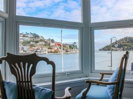 A view of the river and buildings from a living room window at Castleview Apartment, 21 South Embankment in Dartmouth