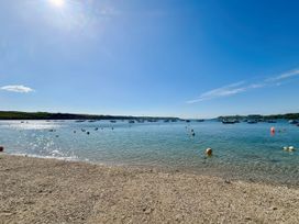A view of boats on water with a beach at The Studio Feock near Truro