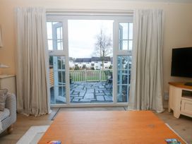 A living room with a view of the outdoor area at The Cottage On The Green Borth-Y-Gest