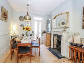 A dining room with a table and chairs at 18 Pakefield Road in Lowestoft