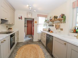 A kitchen with cabinets and a sink at 18 Pakefield Road in Lowestoft