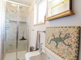 A bathroom featuring a shower and a mosaic tile at 18 Pakefield Road in Lowestoft
