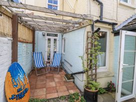 An outdoor area with deck chairs and a table at 18 Pakefield Road in Lowestoft