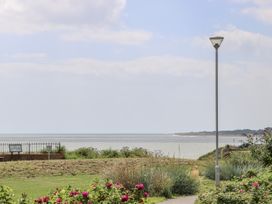 A view of the sea with flowers and a lamp post at 18 Pakefield Road in Lowestoft