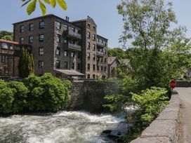 A building next to a river at Old Post Office Cottage Ulverston