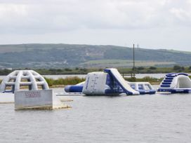 Inflatable obstacles in water at Pott Havehigg Wakepark Backbarrow near Newby Bridge
