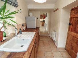 A kitchen with a sink and refrigerator at Deer How Farm Patterdale near Glenridding