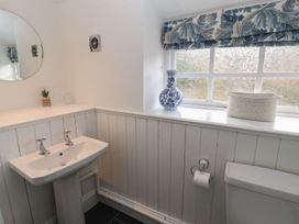 A bathroom with a wash basin and toilet at Deer How Farm in Patterdale near Glenridding