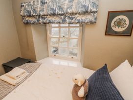 A bedroom with a bed and window at Deer How Farm Patterdale near Glenridding