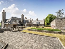 An outdoor area featuring a house and patio furniture at Harcombe House Accessible Pet Free Bungalow Sleeps 6 in Chudleigh