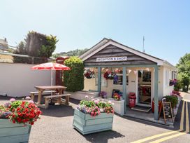 A reception and shop with flowers and seating at Willow's Leap in Uplyme