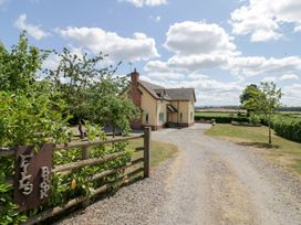A house with a driveway and trees at Filly Brook in Bishop's Frome