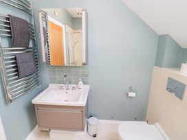 A bathroom with a sink, toilet, and towel radiator at Filly Brook in Bishop's Frome