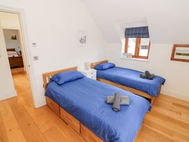A bedroom with two beds and a window at Filly Brook in Bishop's Frome