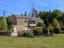 A house with garden and trees at Cleveley Mill in Enstone