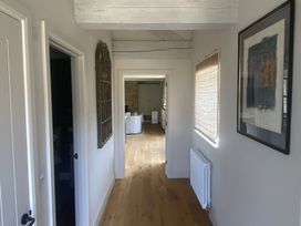 A hallway with doors and a window at The Annexe, Cleveley Mill, Enstone