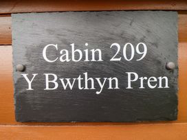 A sign displaying Cabin 209 and Y Bwthyn Pren at Y Bwthyn Pren, Cabin 209, Trawsfynydd