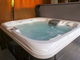 A hot tub filled with water indoors at Seabreeze in Llandudno