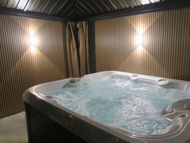 A hot tub in a spa room at Seabreeze in Llandudno