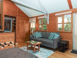 A living room with a sofa and coffee table at The Boat House in Ashprington