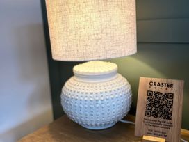A lamp and wifi information sign at Craster House Seahouses