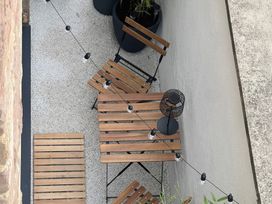 A outdoor space with a table and chairs at Craster House in Seahouses
