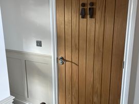 A door with toilet signs at Craster House in Seahouses