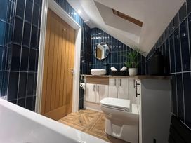 A bathroom with a sink and toilet at Craster House Seahouses
