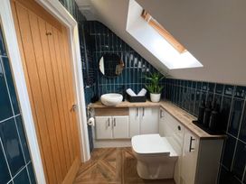 A bathroom with a sink and toilet at Craster House in Seahouses