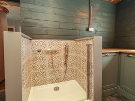 A shower area with patterned tiles at Craster House Seahouses