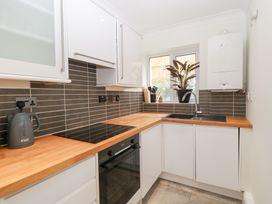 A kitchen with a countertop, sink, and oven at Flat 2 Battledown Grange, Cheltenham