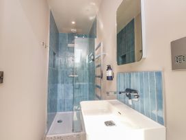 A bathroom with a shower and sink at Ardwyn Rhosneigr